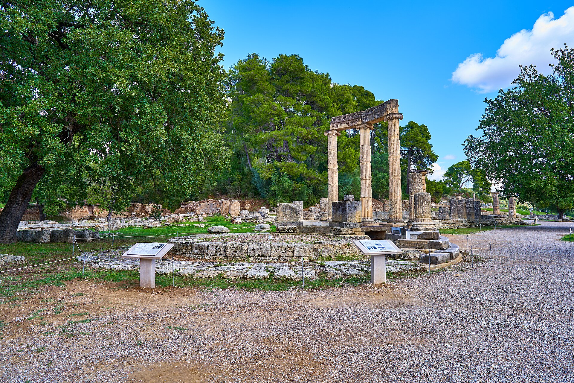 The Philippeion among the ruins and trees of Ancient Olympia